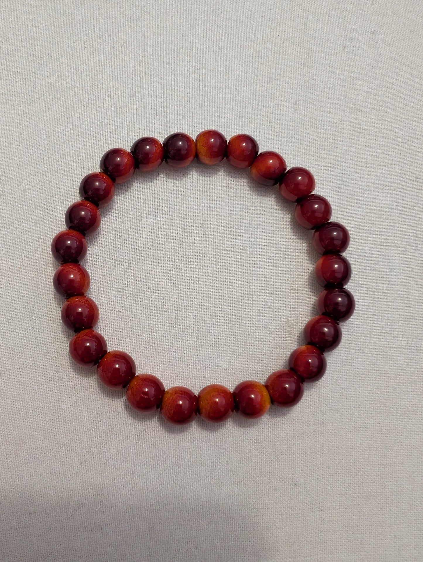 3 orange/red 2 coloured bead bracelet