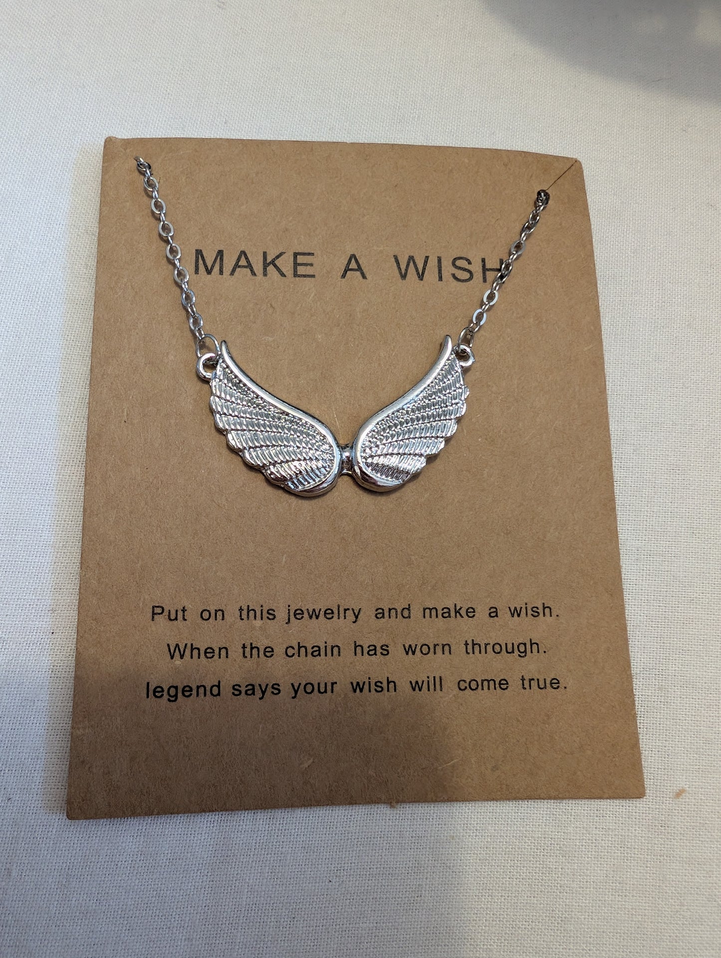 2 silver angle wing necklace meaning