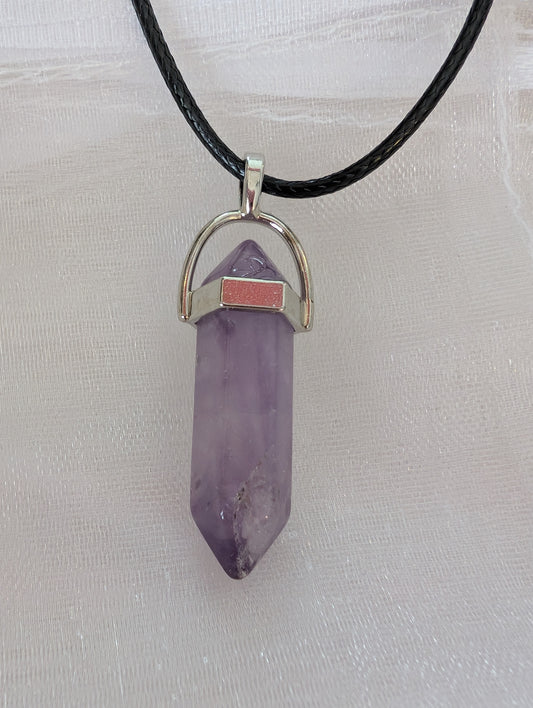 Purple gemstone on black leatherette necklace